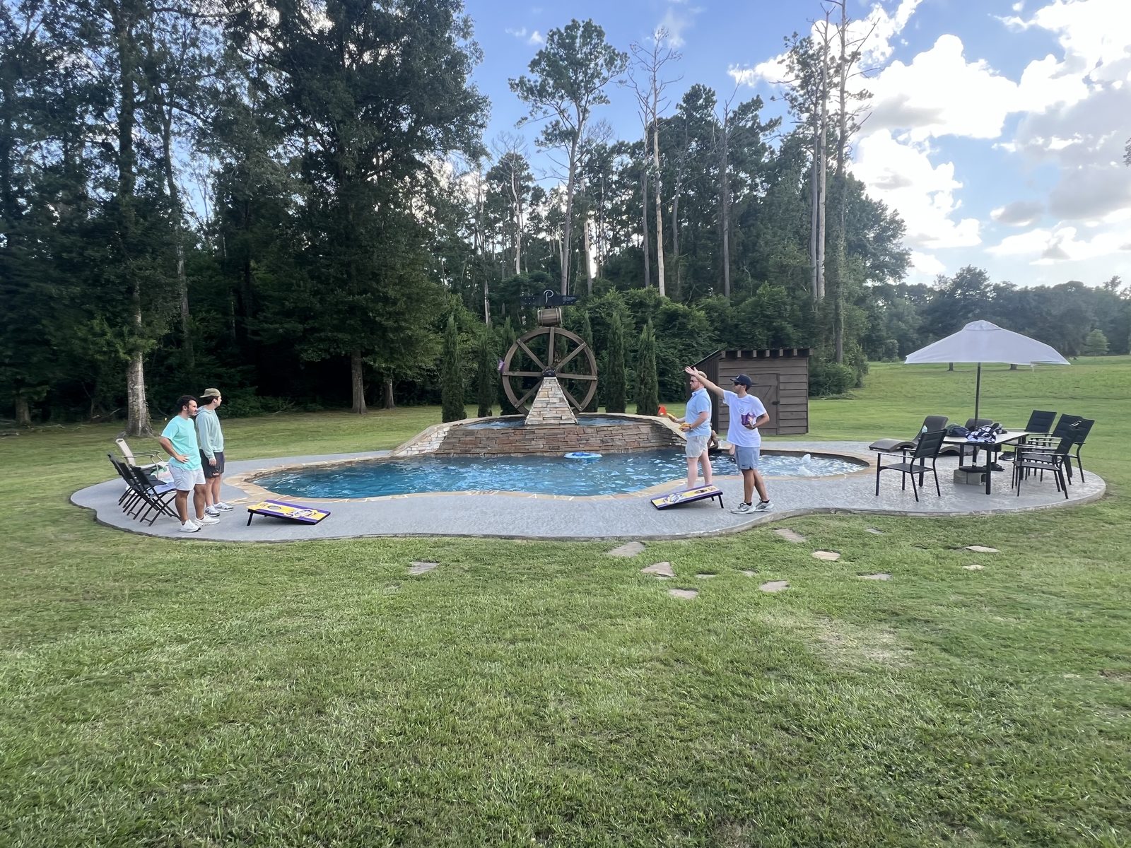 Cornhole beside the pool